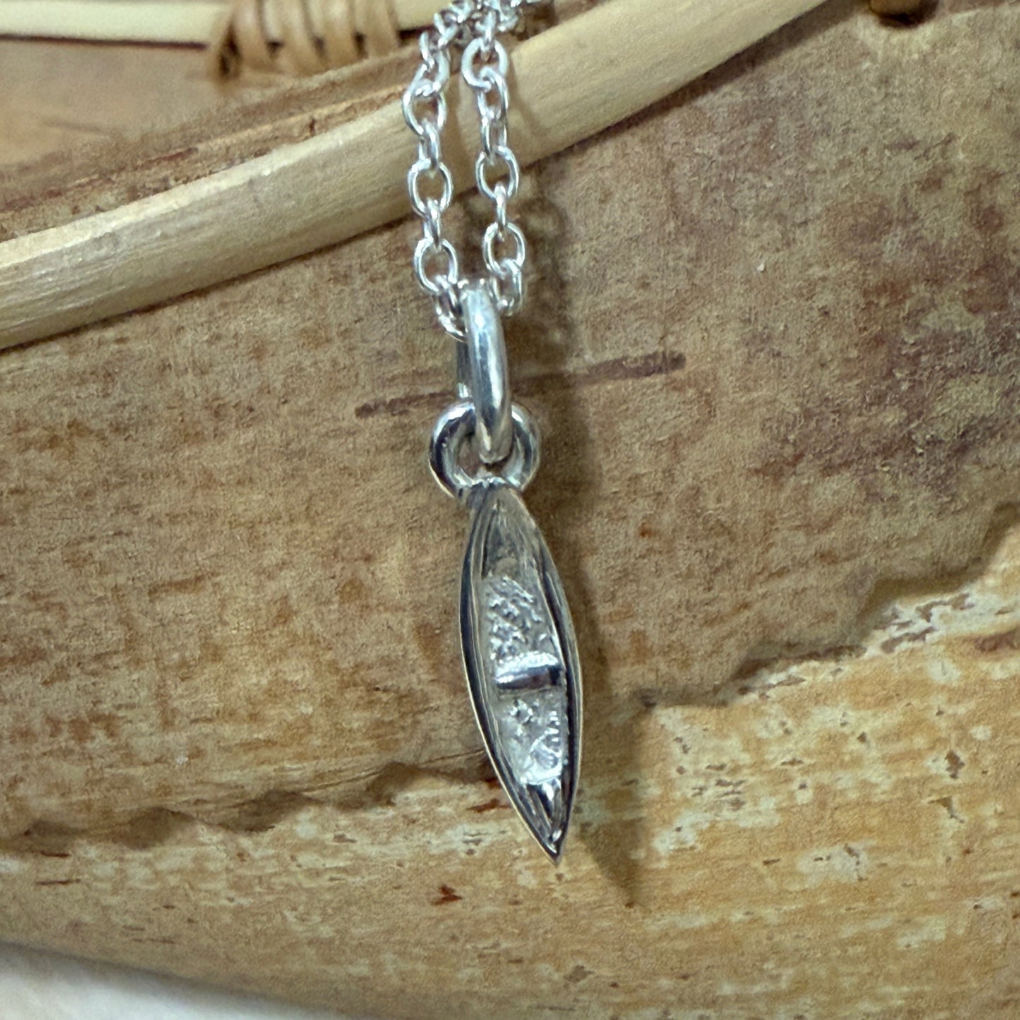 Small sterling silver canoe pendant and chain